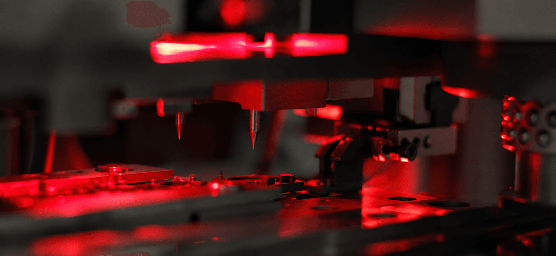 Assembly station under red inspection light in the Rottweil plant